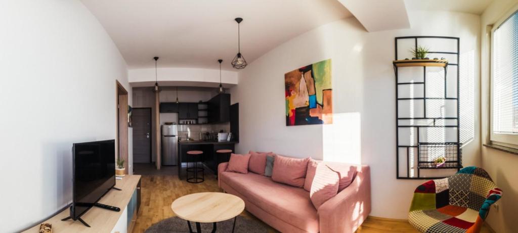 a living room with a couch and a table at Krkulj Apartments in Ohrid