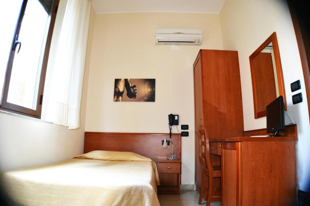 Postel nebo postele na pokoji v ubytování B&B Centrale Affittacamere