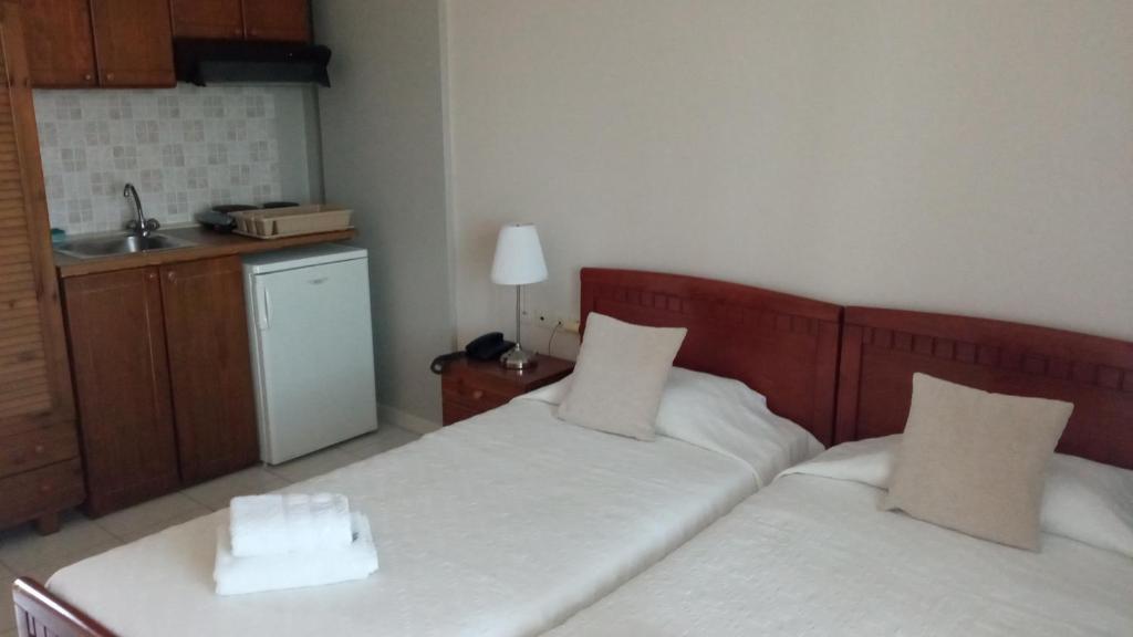 Postel nebo postele na pokoji v ubytování Hotel Pavlos - Studios