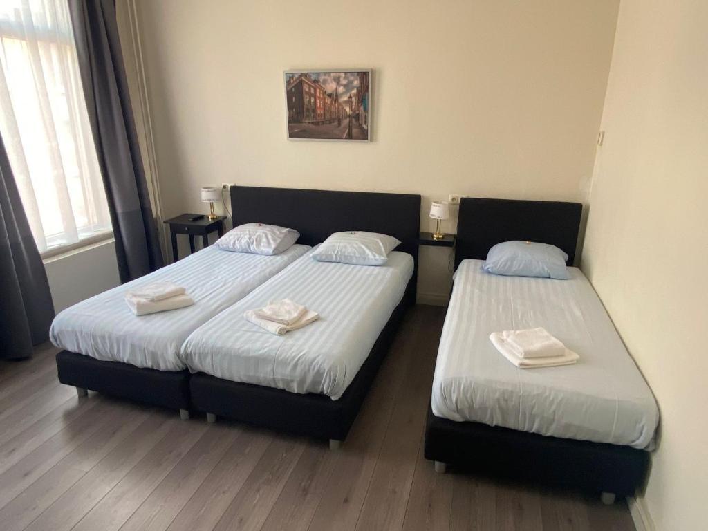 Postel nebo postele na pokoji v ubytování Hotel 't Sonnehuys