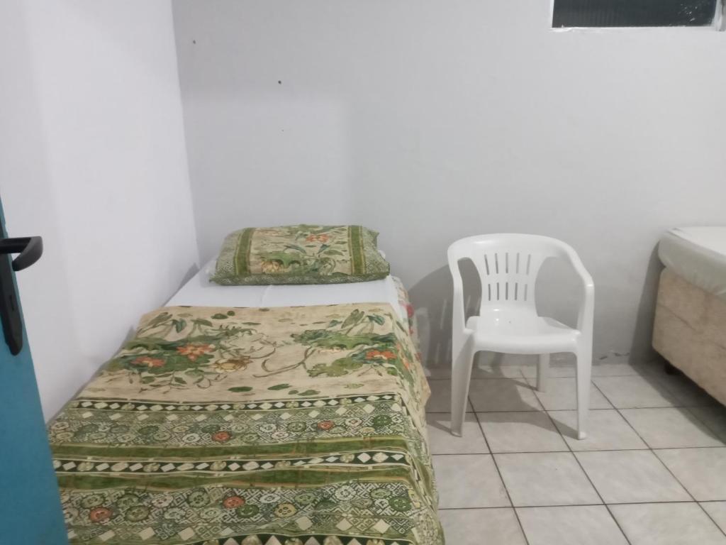 Cama ou camas em um quarto em Tropicália`s House