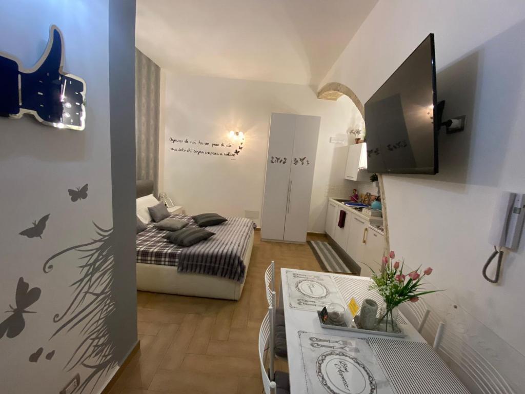 TV a/nebo společenská místnost v ubytování Residence Emozioni Ortigia