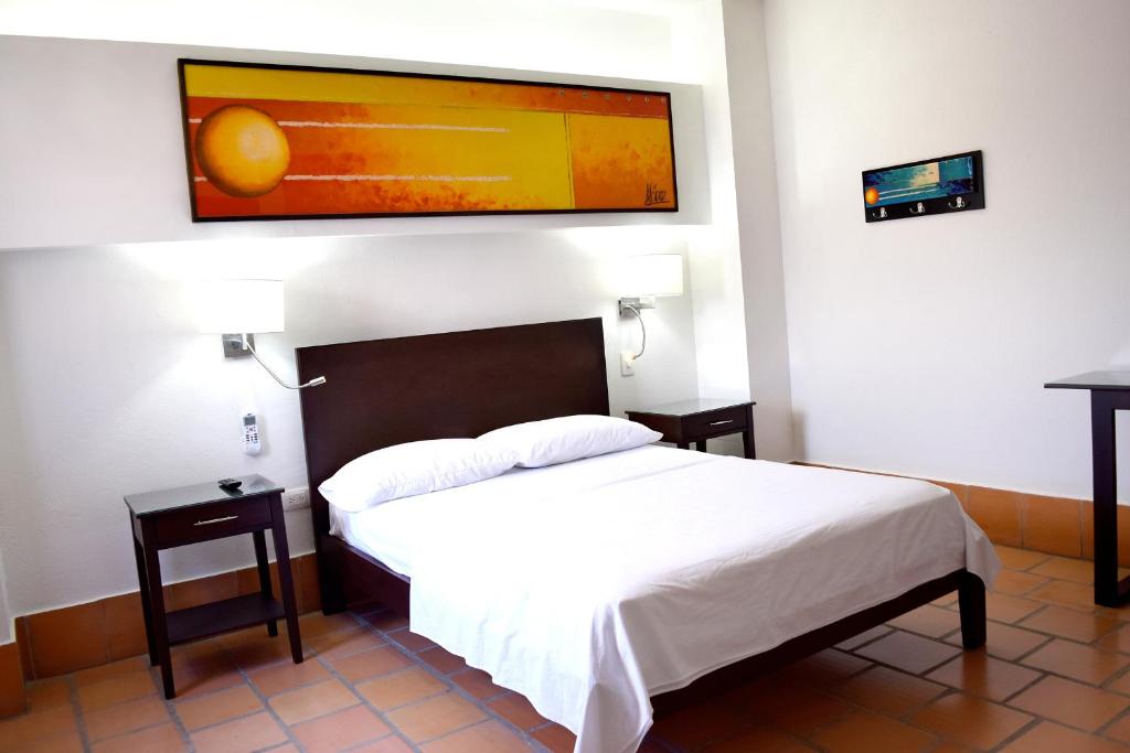 Postel nebo postele na pokoji v ubytování Chrisban Hotel Boutique