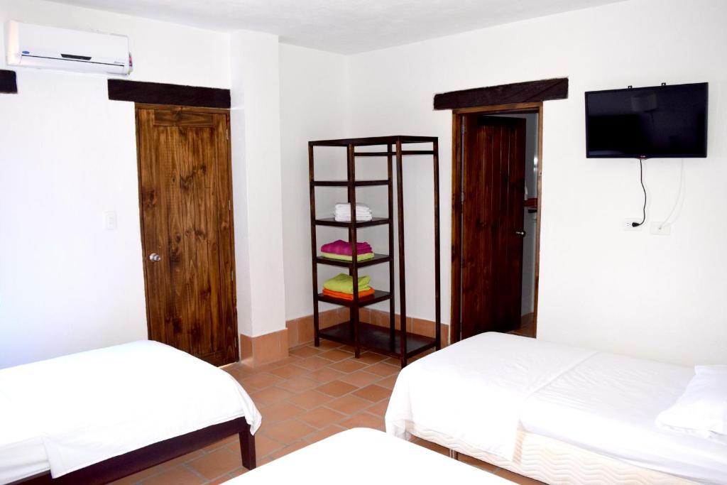 Postel nebo postele na pokoji v ubytování Chrisban Hotel Boutique