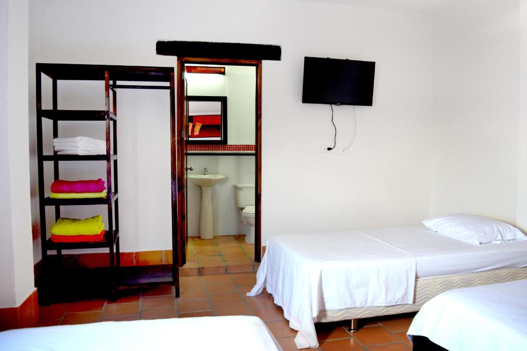 Postel nebo postele na pokoji v ubytování Chrisban Hotel Boutique