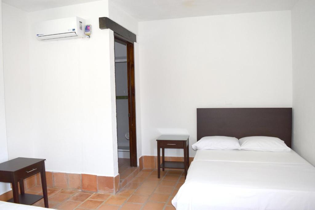 Postel nebo postele na pokoji v ubytování Chrisban Hotel Boutique