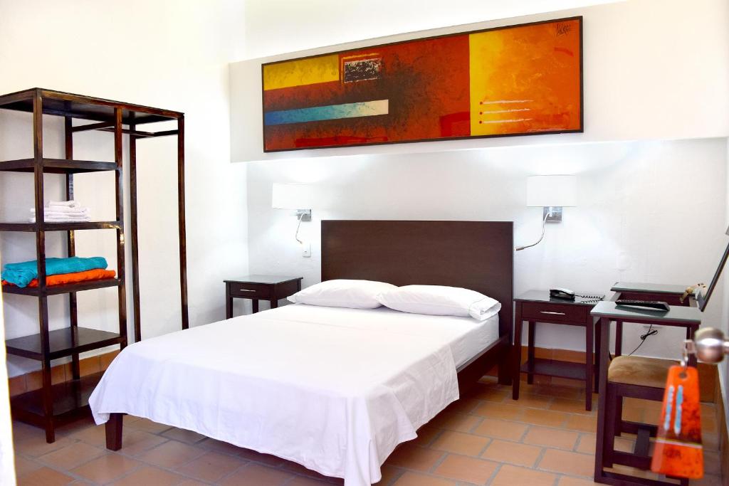 Postel nebo postele na pokoji v ubytování Chrisban Hotel Boutique