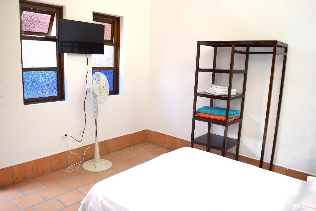 Postel nebo postele na pokoji v ubytování Chrisban Hotel Boutique