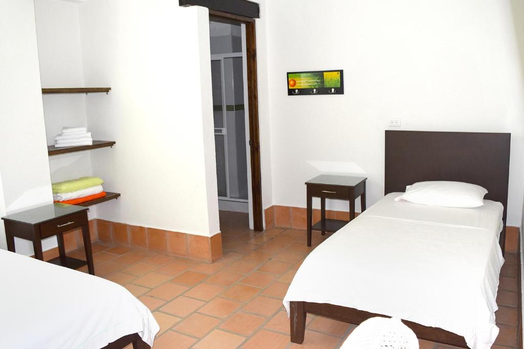 Postel nebo postele na pokoji v ubytování Chrisban Hotel Boutique