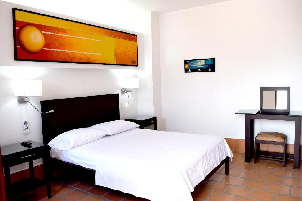 Postel nebo postele na pokoji v ubytování Chrisban Hotel Boutique