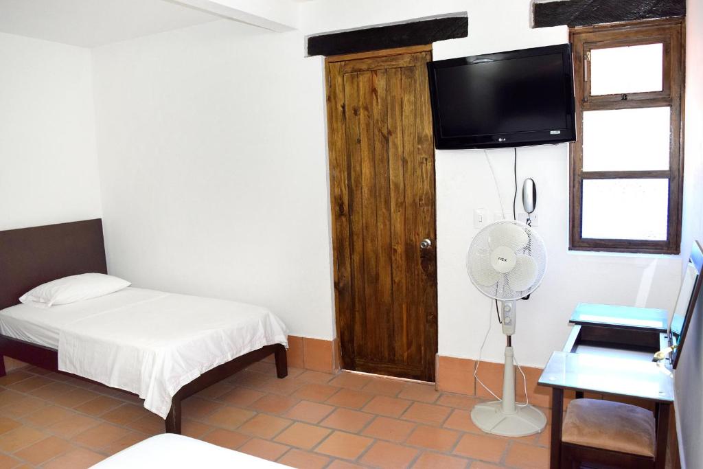 Postel nebo postele na pokoji v ubytování Chrisban Hotel Boutique