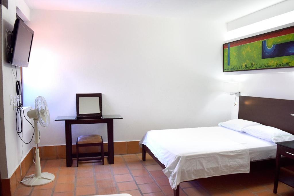 TV a/nebo společenská místnost v ubytování Chrisban Hotel Boutique