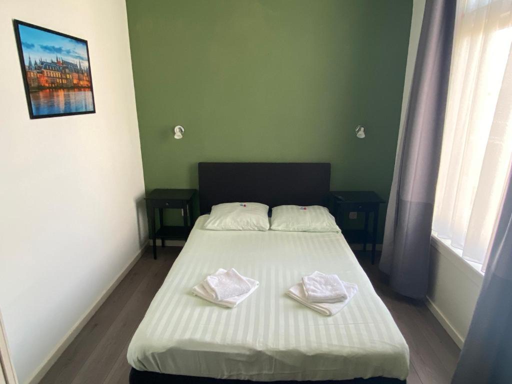 Postel nebo postele na pokoji v ubytování Hotel 't Sonnehuys