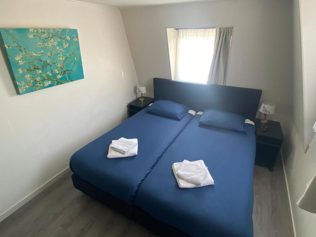 Postel nebo postele na pokoji v ubytování Hotel 't Sonnehuys