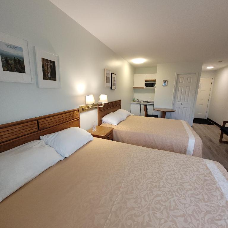 Postel nebo postele na pokoji v ubytování Ridgeview Motor Inn