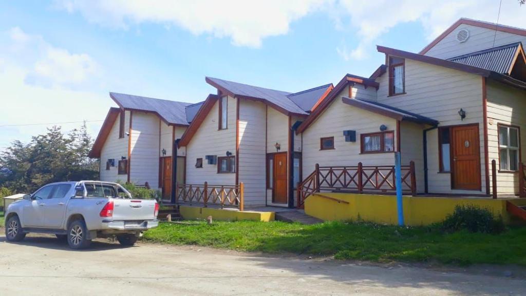 a house with a car parked in front of it at La Barranca in Ushuaia