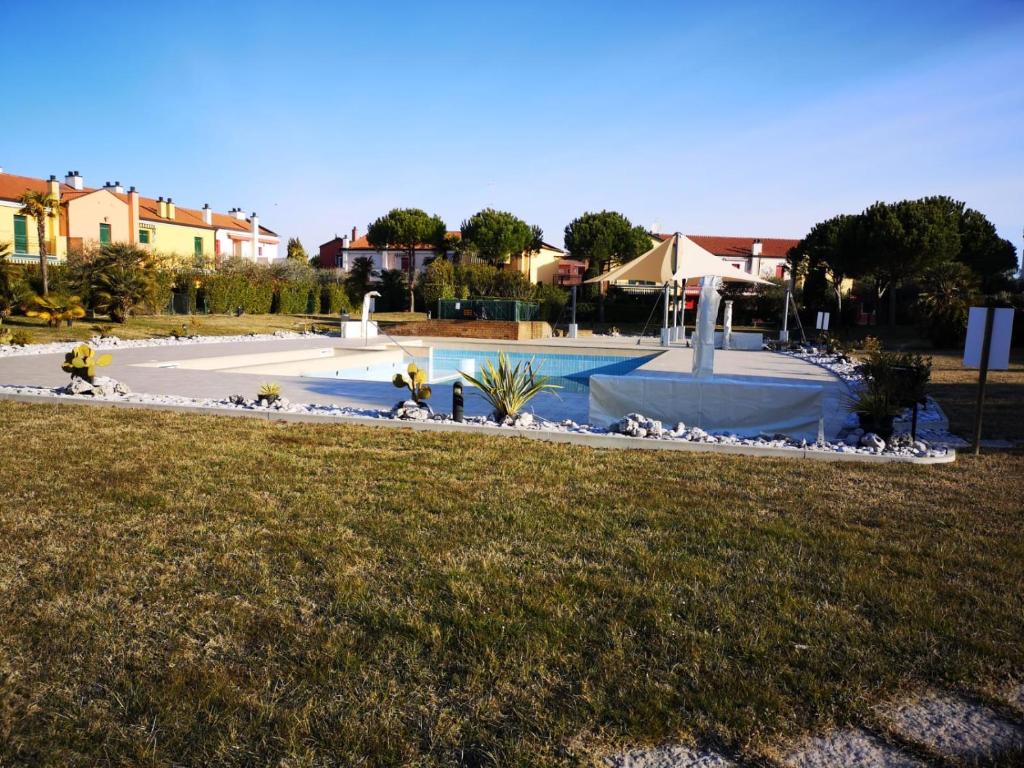 Bazén v ubytování MI CASA E SU CASA - welcome to Lignano! nebo v jeho okolí