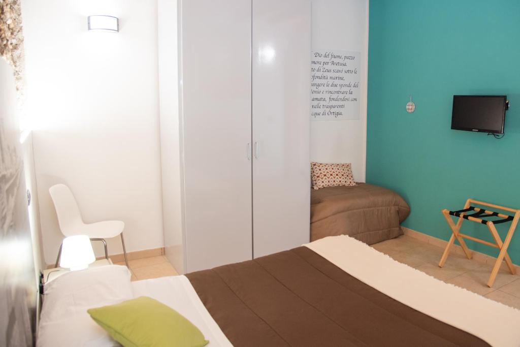 Postel nebo postele na pokoji v ubytování B&B Vicolo IV