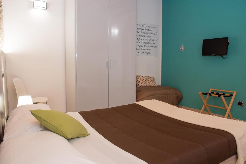 Postel nebo postele na pokoji v ubytování B&B Vicolo IV