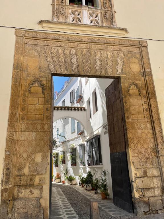 an entrance to a building with an open door at Vallaindiano in Córdoba