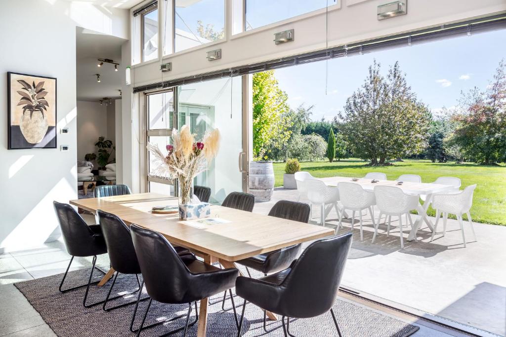 a dining room with a table and chairs at Paradise on Campbell in Martinborough