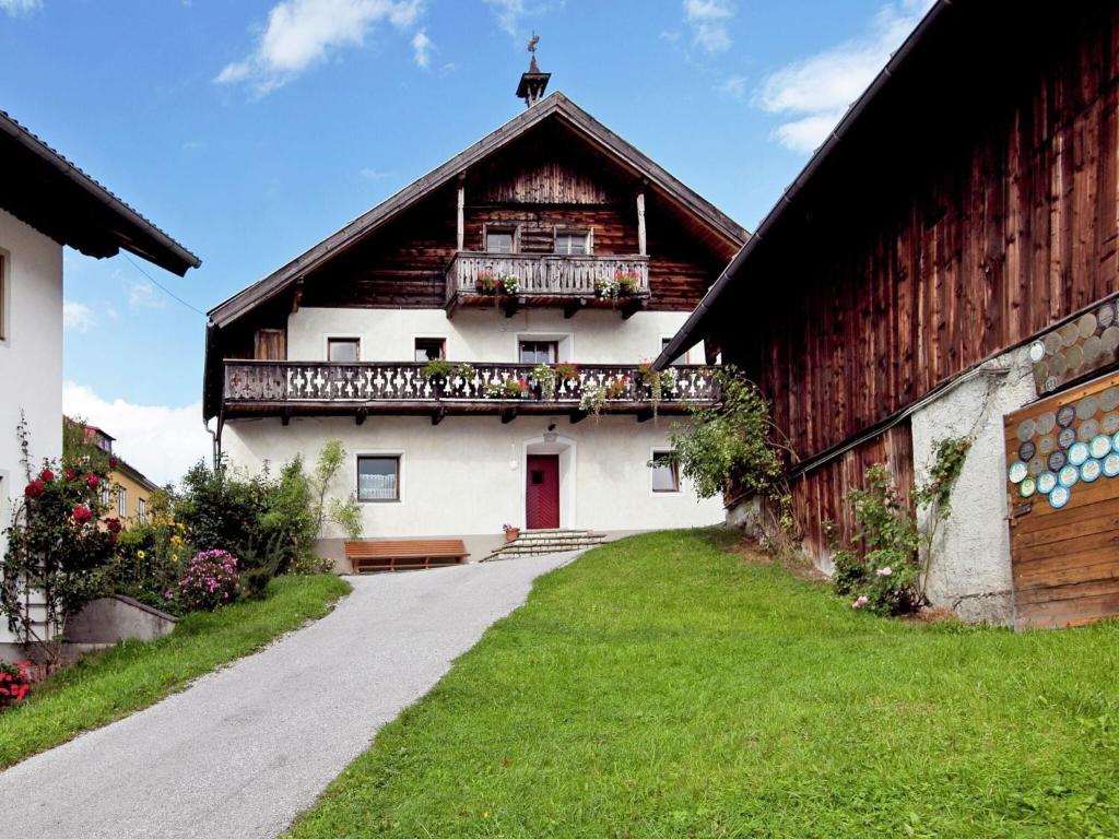 a building with a balcony on the side of it at Spacious Holiday Home in Sankt Johann im Pongau with Garden in Sankt Johann im Pongau