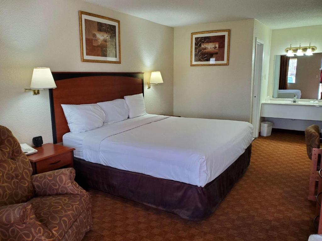Ένα ή περισσότερα κρεβάτια σε δωμάτιο στο Motel 6 Shamrock TX