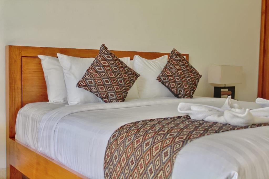 Postel nebo postele na pokoji v ubytování Bali Ayu Hotel & Villas