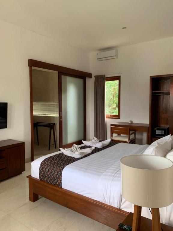Postel nebo postele na pokoji v ubytování Bali Ayu Hotel & Villas