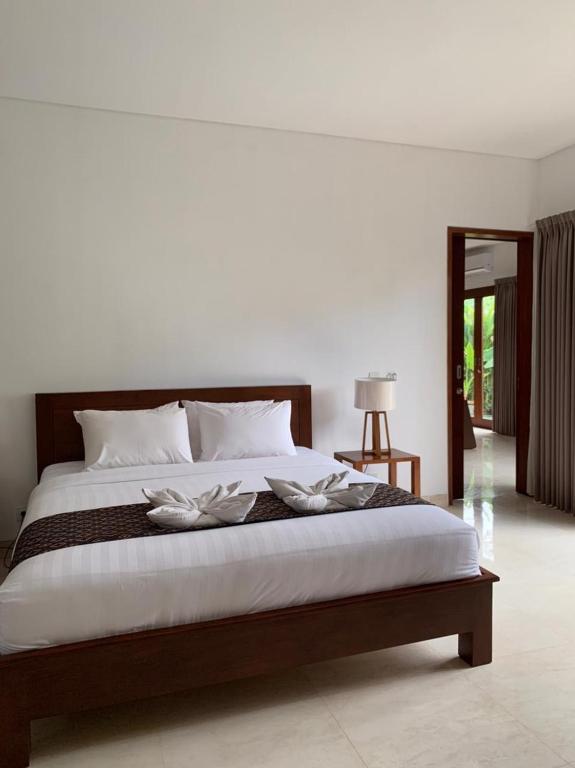 Postel nebo postele na pokoji v ubytování Bali Ayu Hotel & Villas