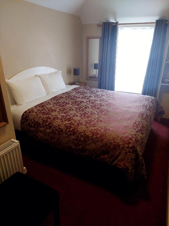 Postel nebo postele na pokoji v ubytování Parkway Guesthouse