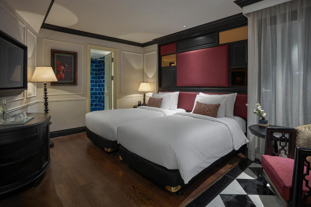 Кровать или кровати в номере Aira Boutique Hanoi Hotel & Spa