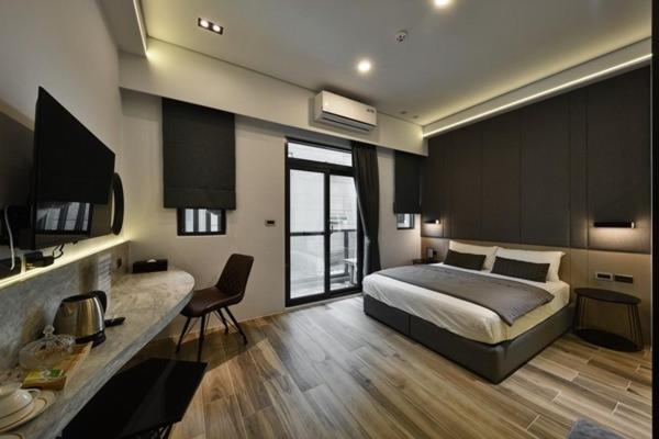 Postel nebo postele na pokoji v ubytování KK Homestay