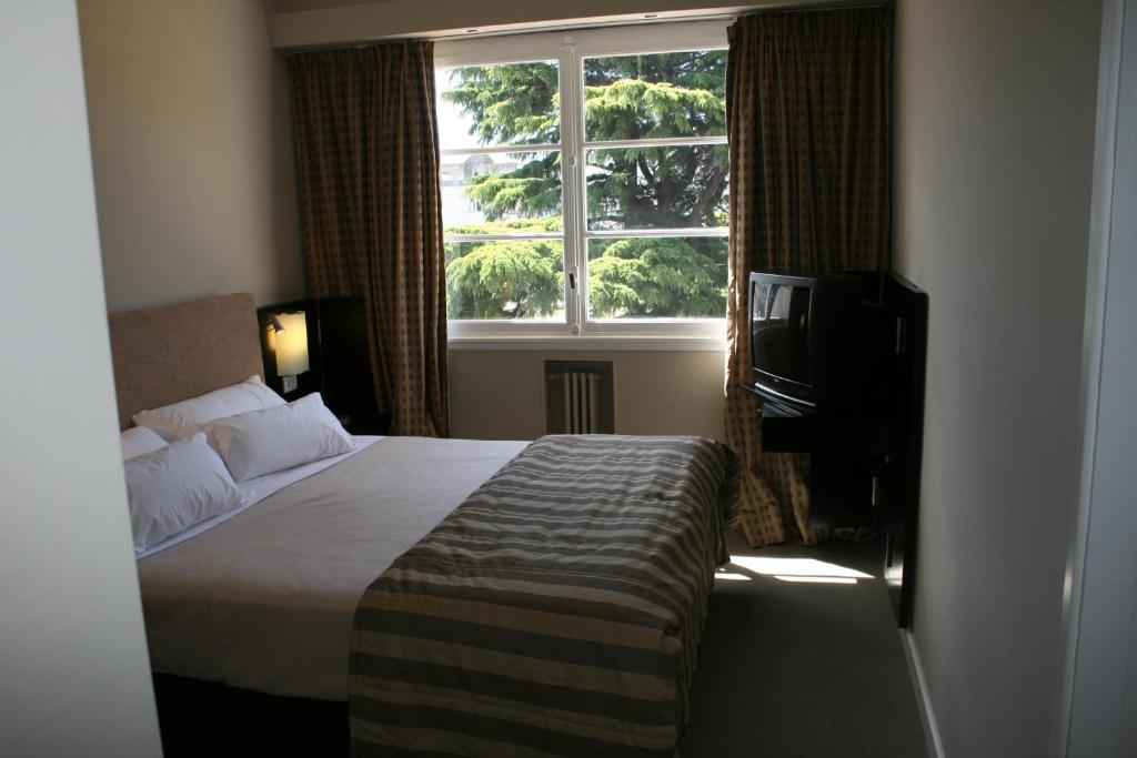 Una cama o camas en una habitación de Gran Hotel Azul