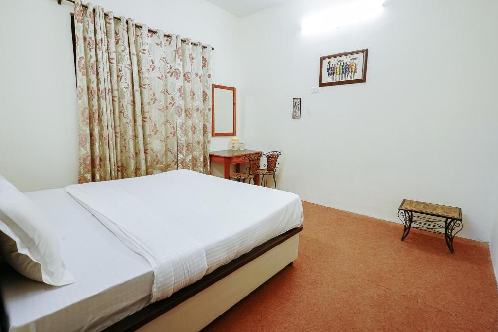 Postel nebo postele na pokoji v ubytování Hotel Sagarmatha