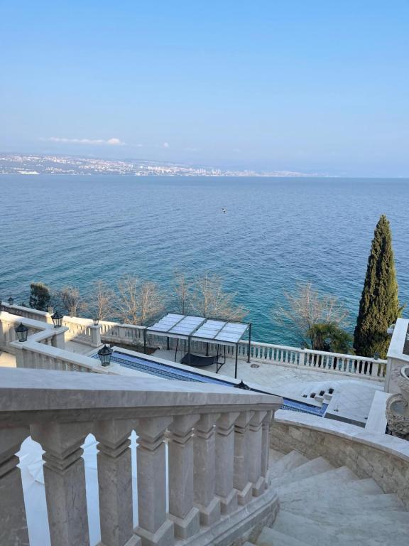 a view of the ocean from the balcony of a building at Apartments Villa Isabella in Opatija
