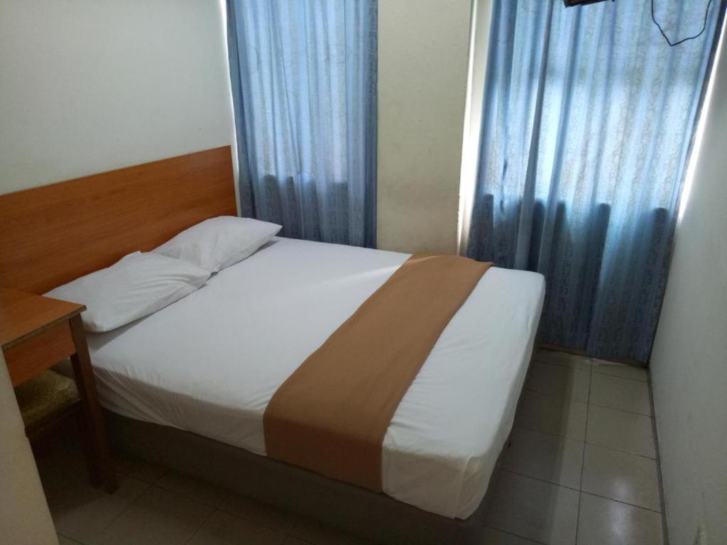 Postel nebo postele na pokoji v ubytování SHA LA LA