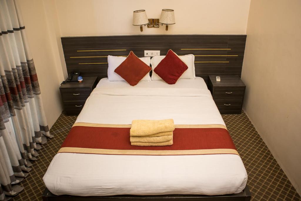 Postel nebo postele na pokoji v ubytování Mirage Inn
