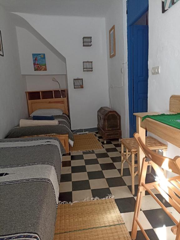 Vallparadis Pension Familiar" FIRDAUS"房間的床