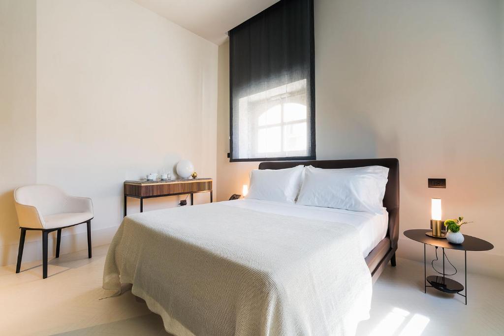 Postel nebo postele na pokoji v ubytování Byssus Suites