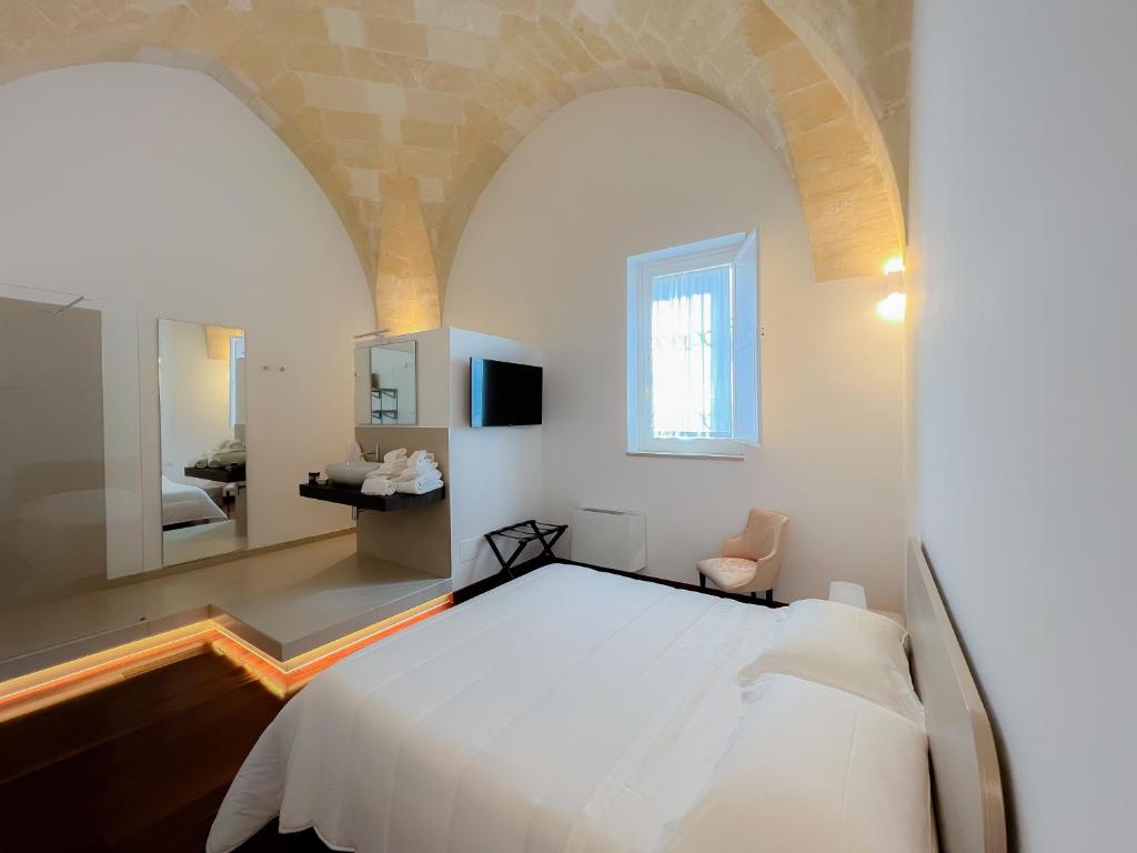 Postel nebo postele na pokoji v ubytování Tulliani Residenze Matera
