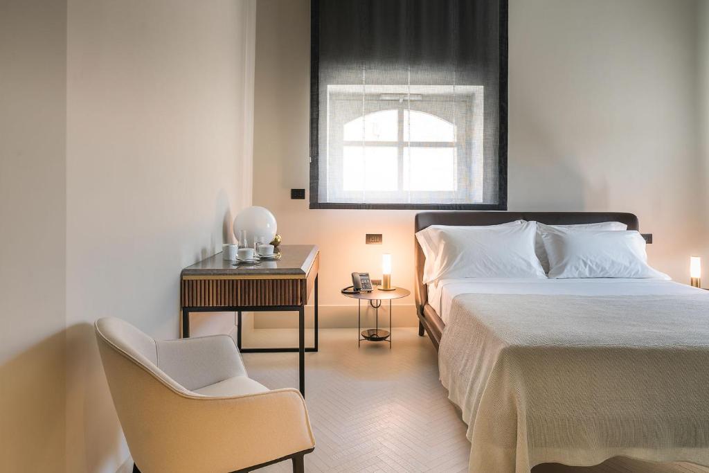 Postel nebo postele na pokoji v ubytování Byssus Suites