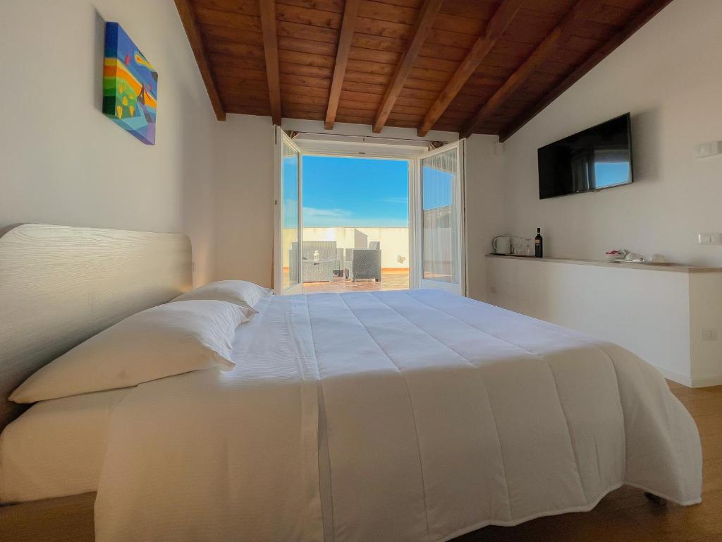Postel nebo postele na pokoji v ubytování Tulliani Residenze Matera