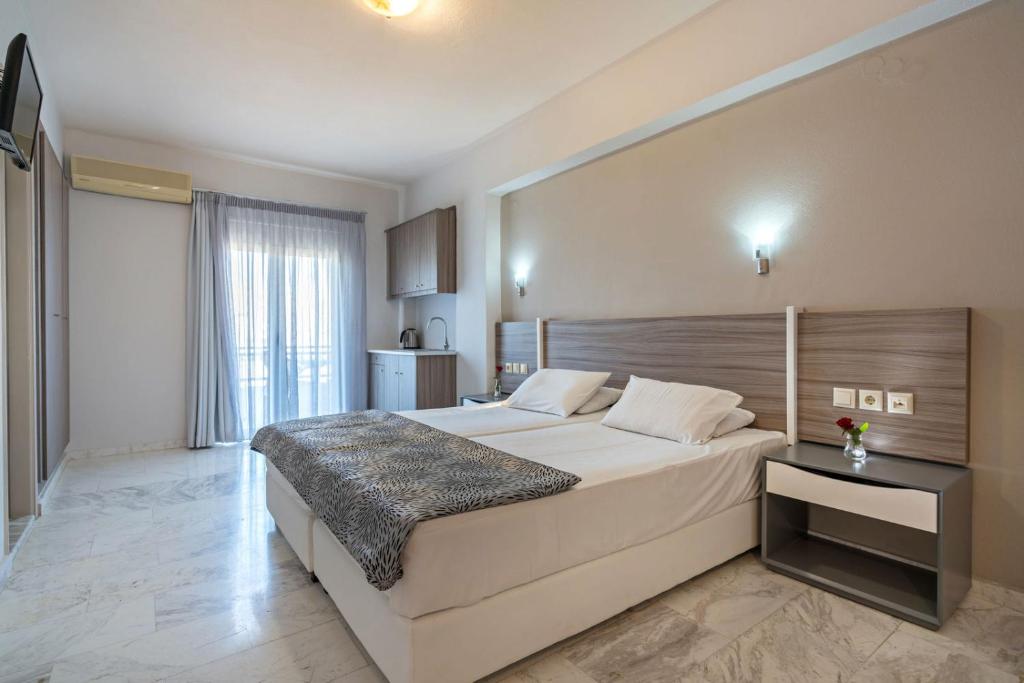 Postel nebo postele na pokoji v ubytování Apollo Hotel 1