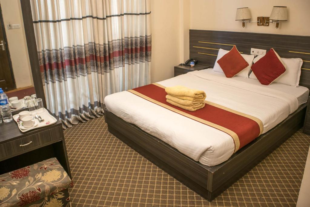 Postel nebo postele na pokoji v ubytování Mirage Inn