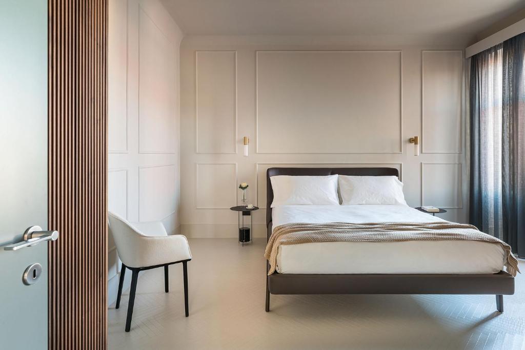 Postel nebo postele na pokoji v ubytování Byssus Suites