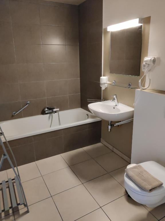 Koupelna v ubytování Flandrien Hotel