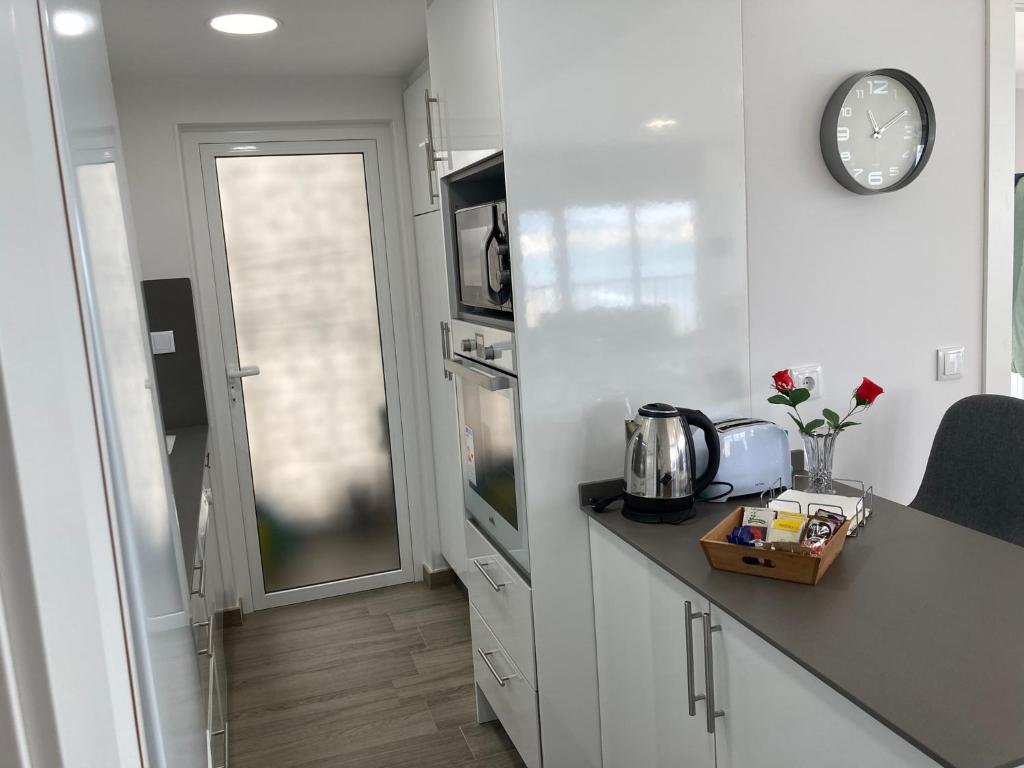 A kitchen or kitchenette at Happy stay