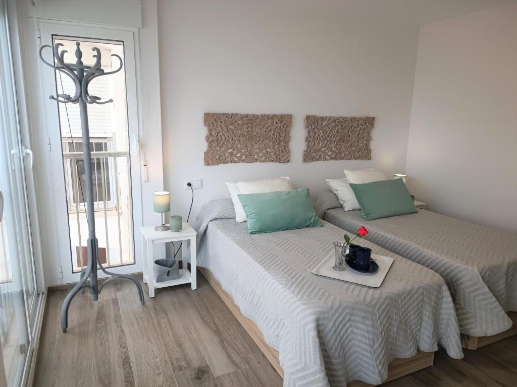A bed or beds in a room at Happy stay