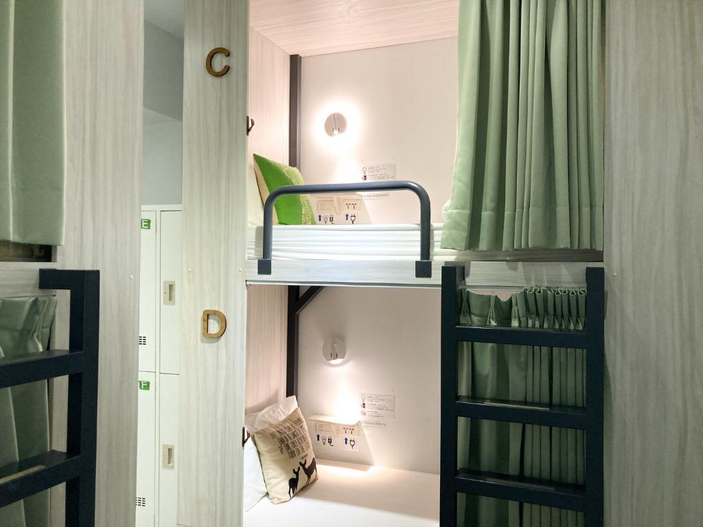 Postel nebo postele na pokoji v ubytování 4Plus Hostel